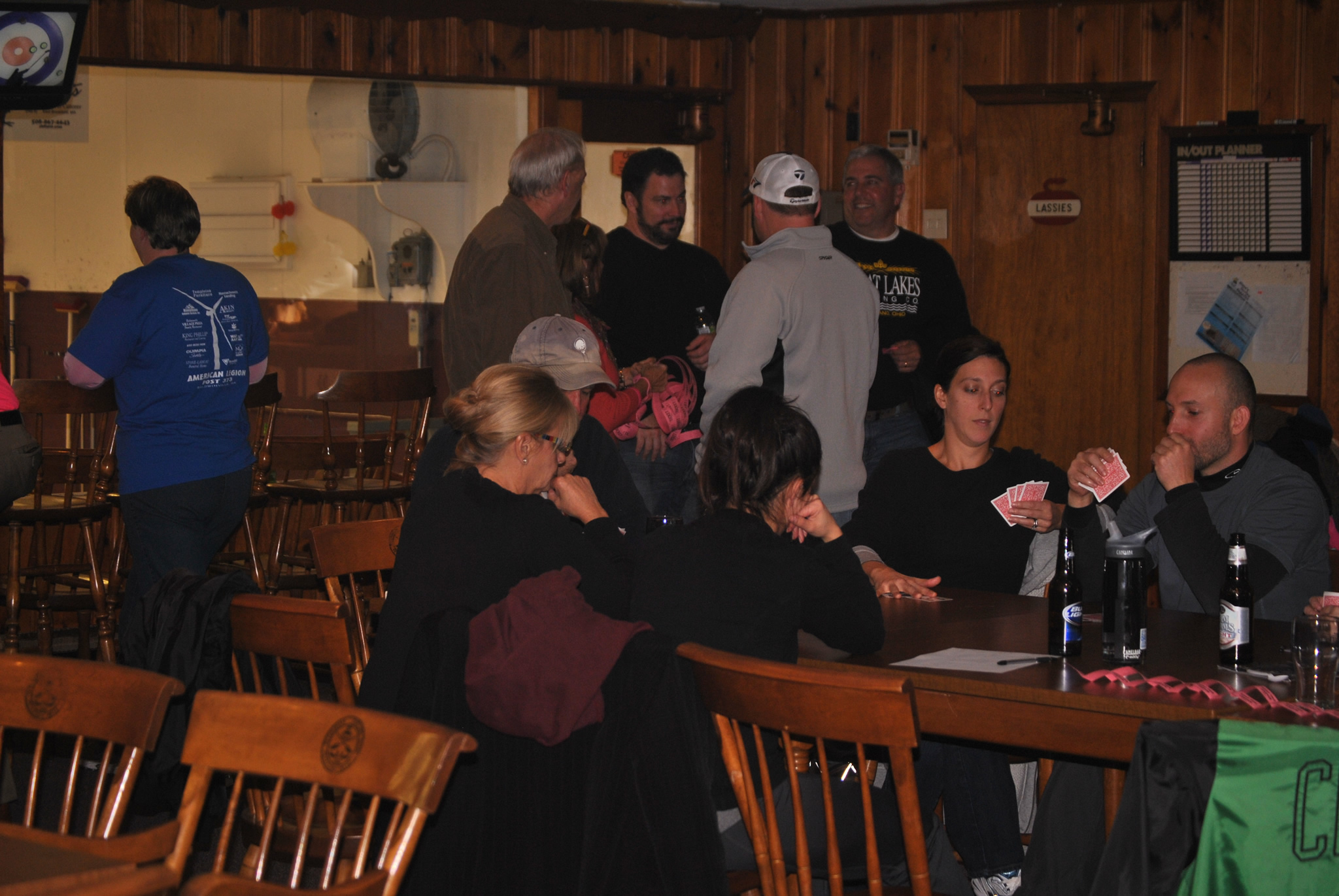 participants socializing in the curling club's warm room